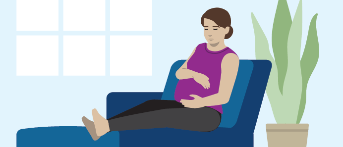 Pregnant person relaxing on a chair