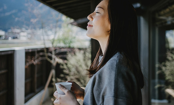 Person relaxing with a cup of coffee