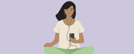 Person listening to their phone with headphones