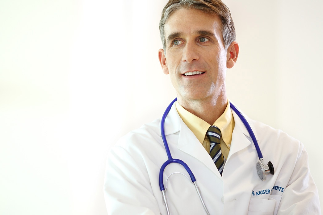 Physician noticing somewone out of frame