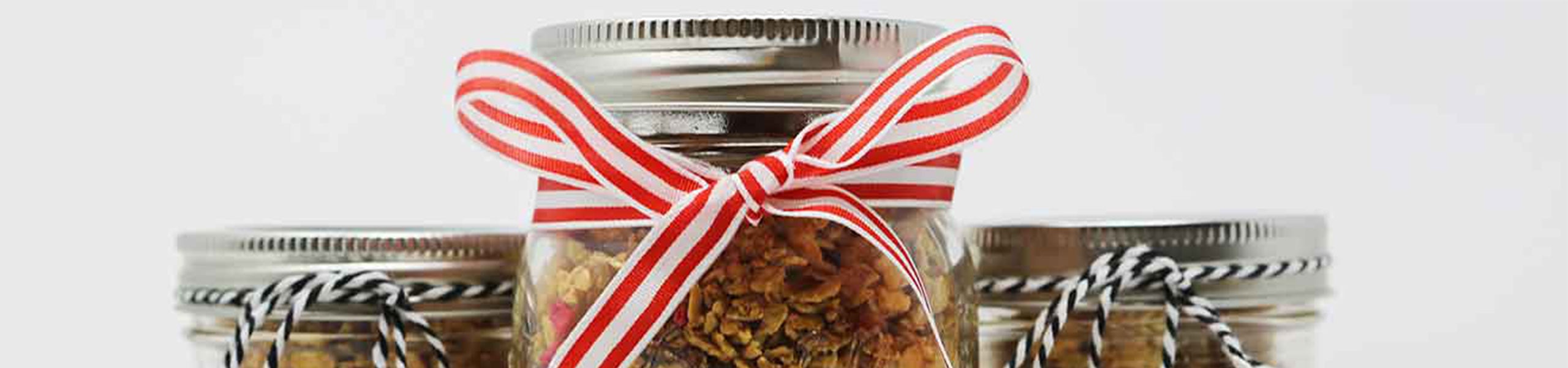 Jars of homemade treats tied with ribbon
