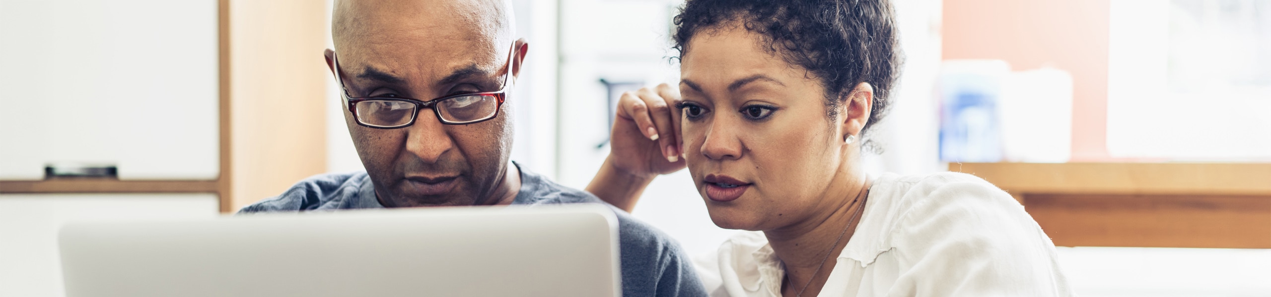 Couple looking at laptop