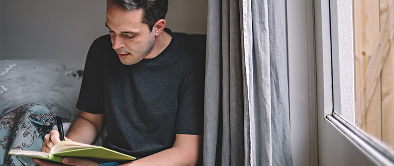 A man writes in his diabetes journal