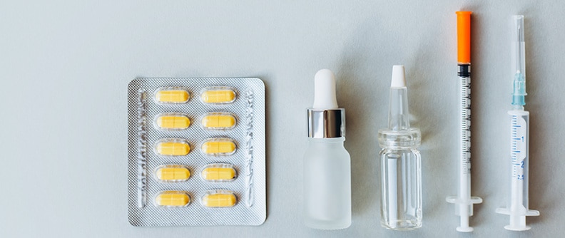 Multiple insulin medication types are displayed on a table