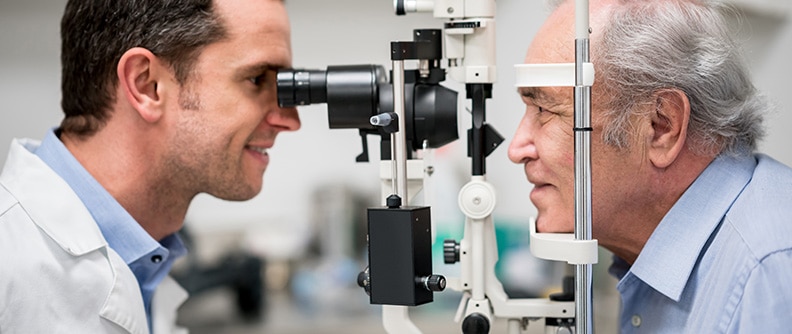 An older man gets an eye exam