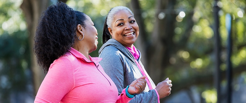 Two women walk and talk