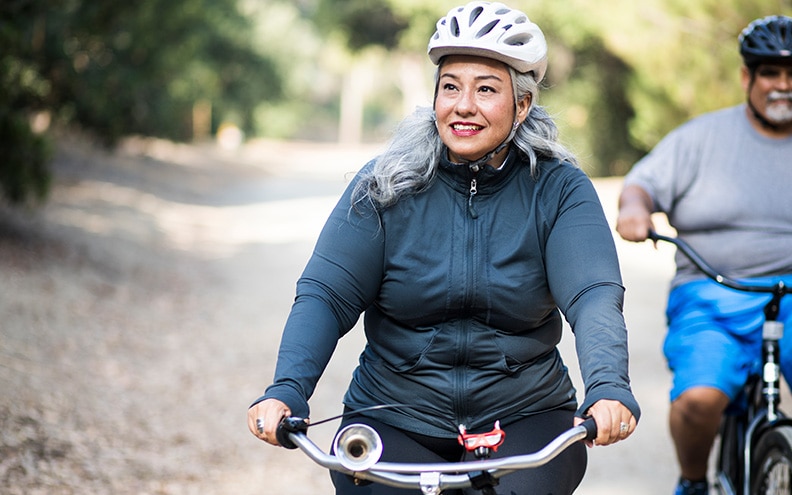 A woman rides her bike for exercise