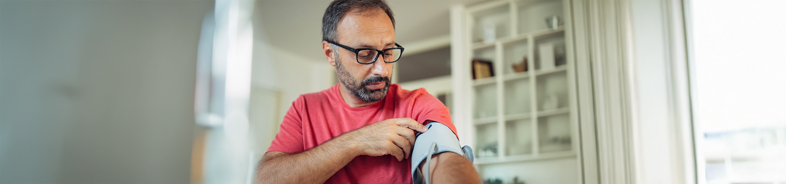 Person checking their blood pressure at home