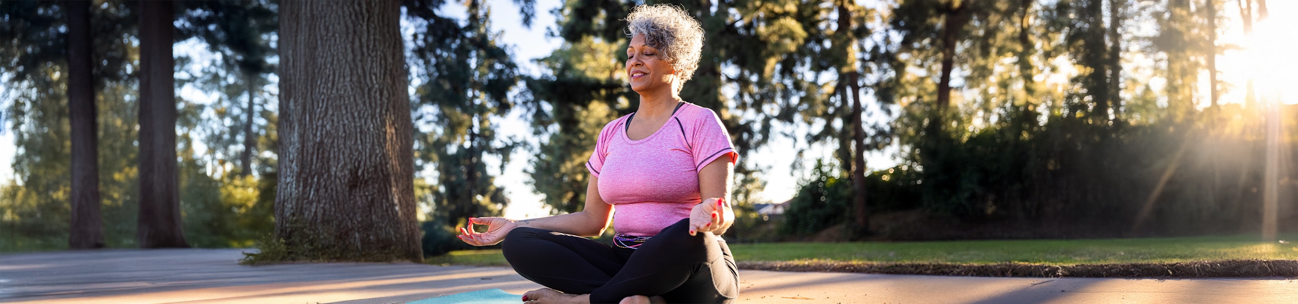 Person meditating outside