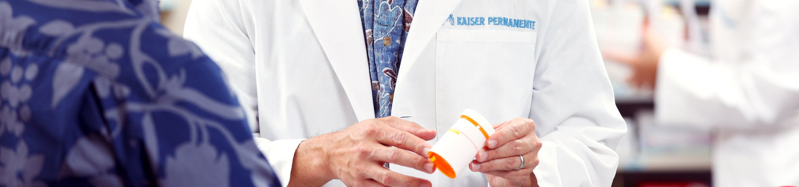 Pharmacist holding a prescription bottle