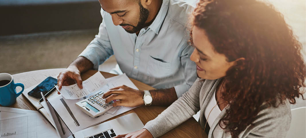 Two people reviewing insurance paperwork