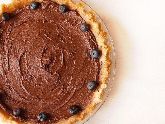 pie with creamy chocolate filling and garnished with blueberries