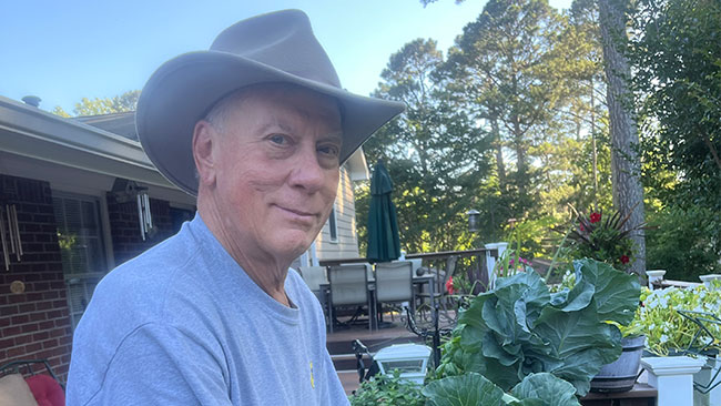 Kent Nicholson tends to his garden. Kent Nicholson tends to his garden.