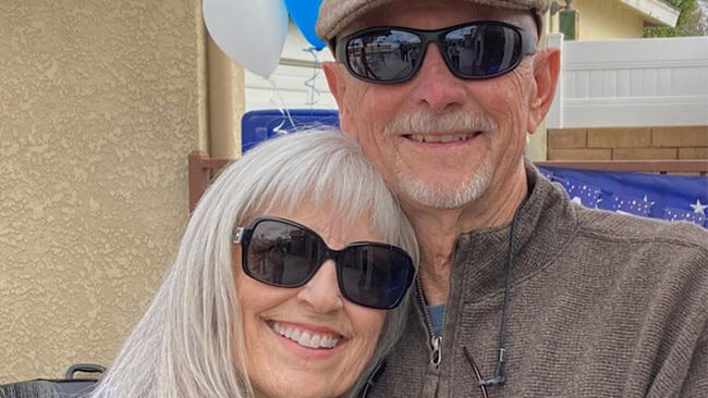 Larry Judd hugging his wife