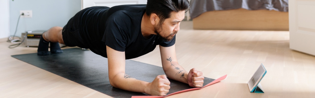 Man doing yoga at home