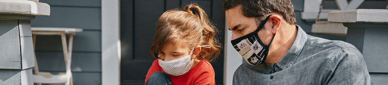 Parent and child in masks getting ready to leave home. 