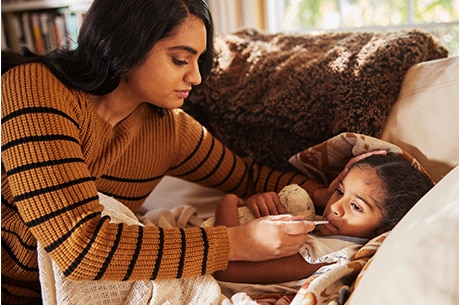 Parent taking child’s temperature