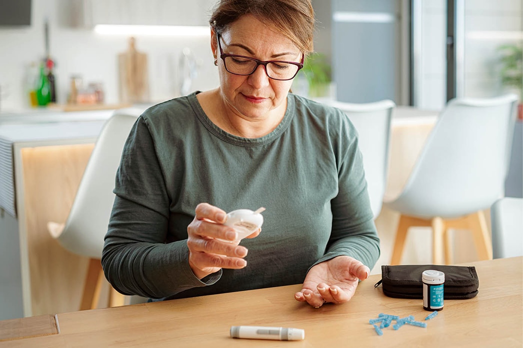 Person checking glucose strip