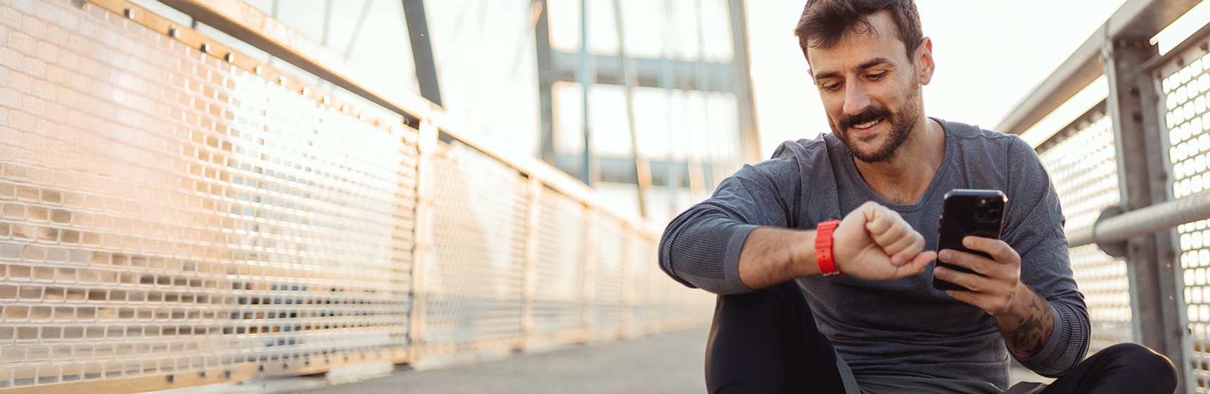 Person checking smartwatch during exercise session