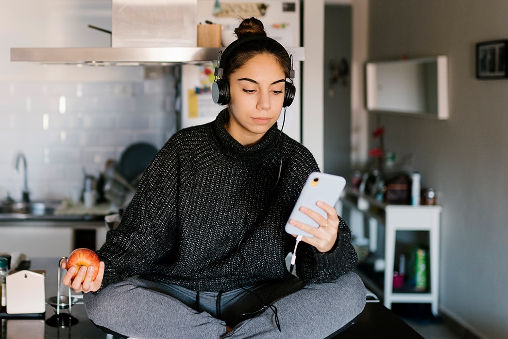 Person reading their phone while listening to music