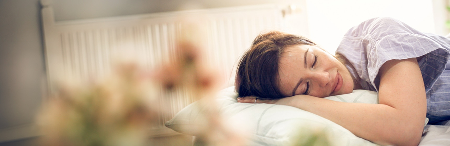 Person sleeping peacefully in bed