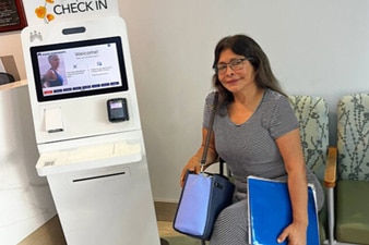 Smiling person in Kaiser Permanente clinic