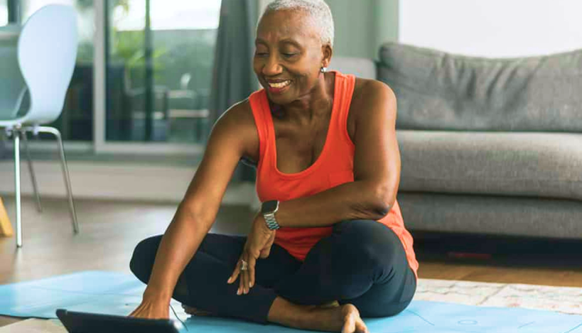 Person uses tablet for yoga