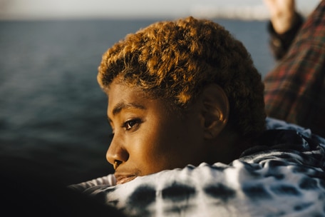 Young person looking at the horizon