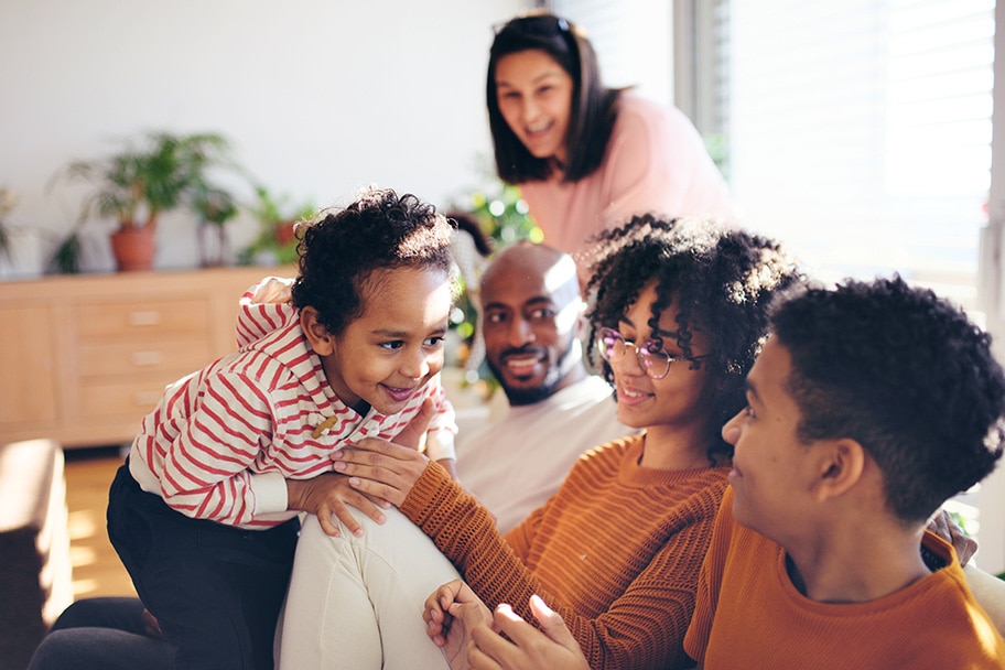 A family sitting on a couch