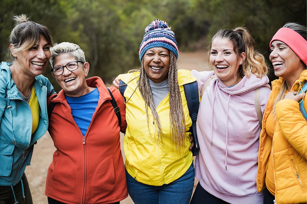 Group of friends laughing on a hike