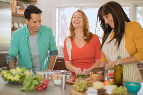 Group of people cooking in a kitchen