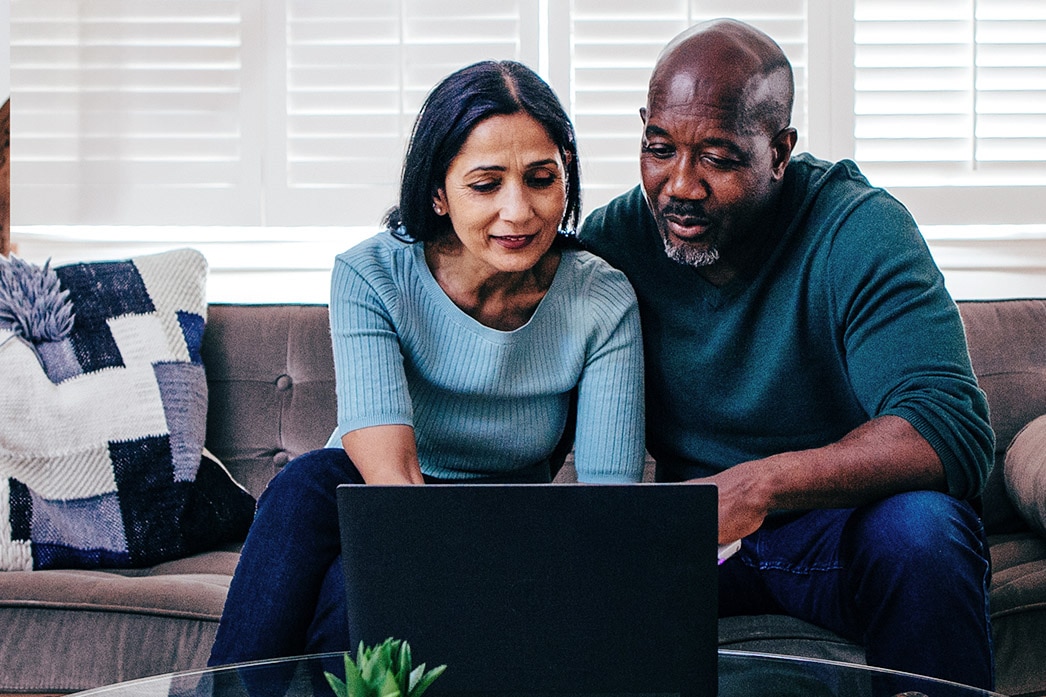 Couple using laptop