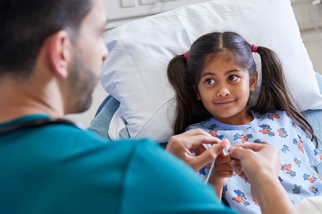 Nurse treating a child