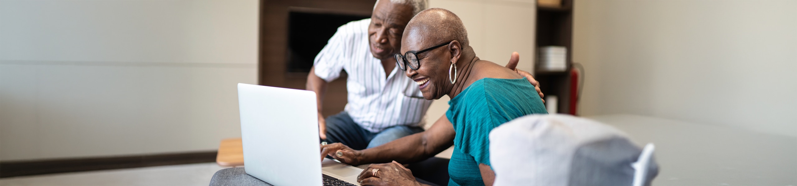 Older couple looking at a laptop