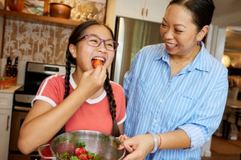 Parent and child enjoying healthy food