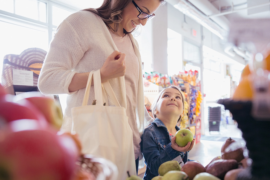 Parent and child grocery shopping 