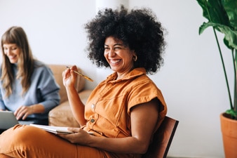 Two people smiling in an office