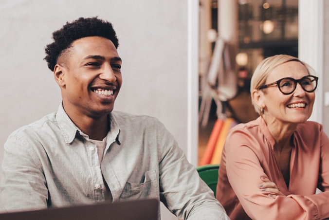 Two people smiling