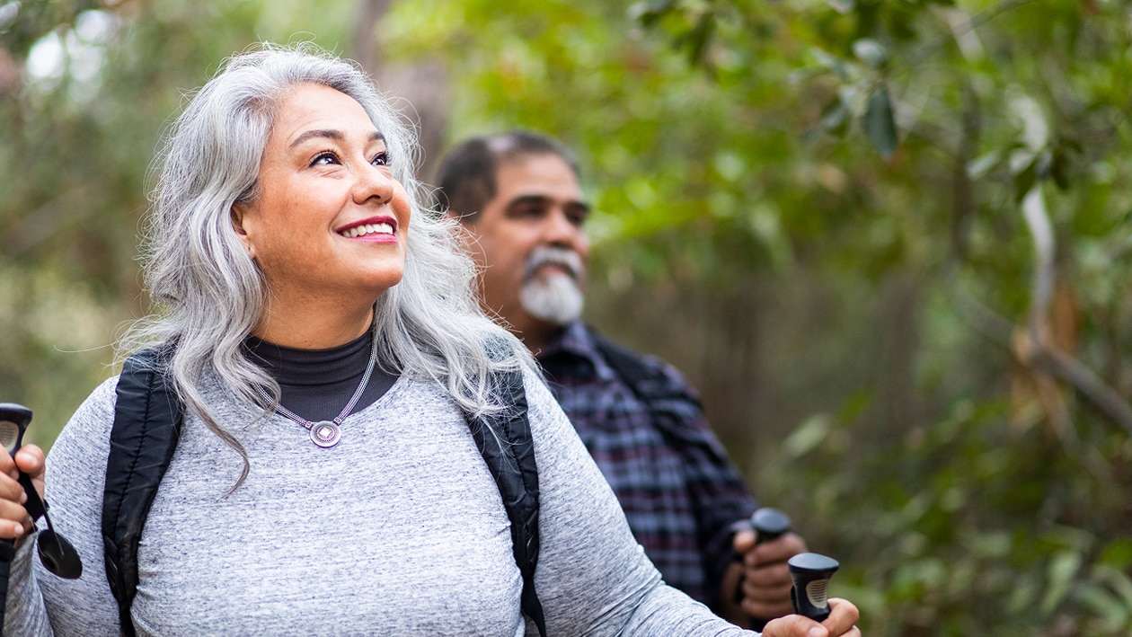 Woman man hiking in forest