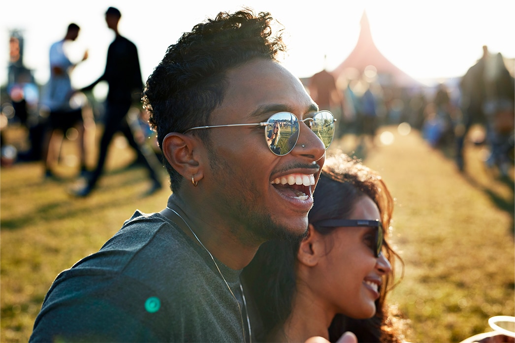 A couple enjoying a festival at a park
