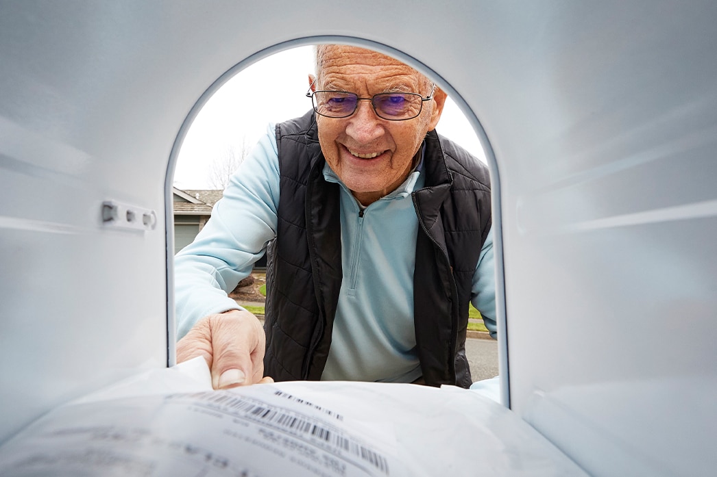 A person checking their mailbox