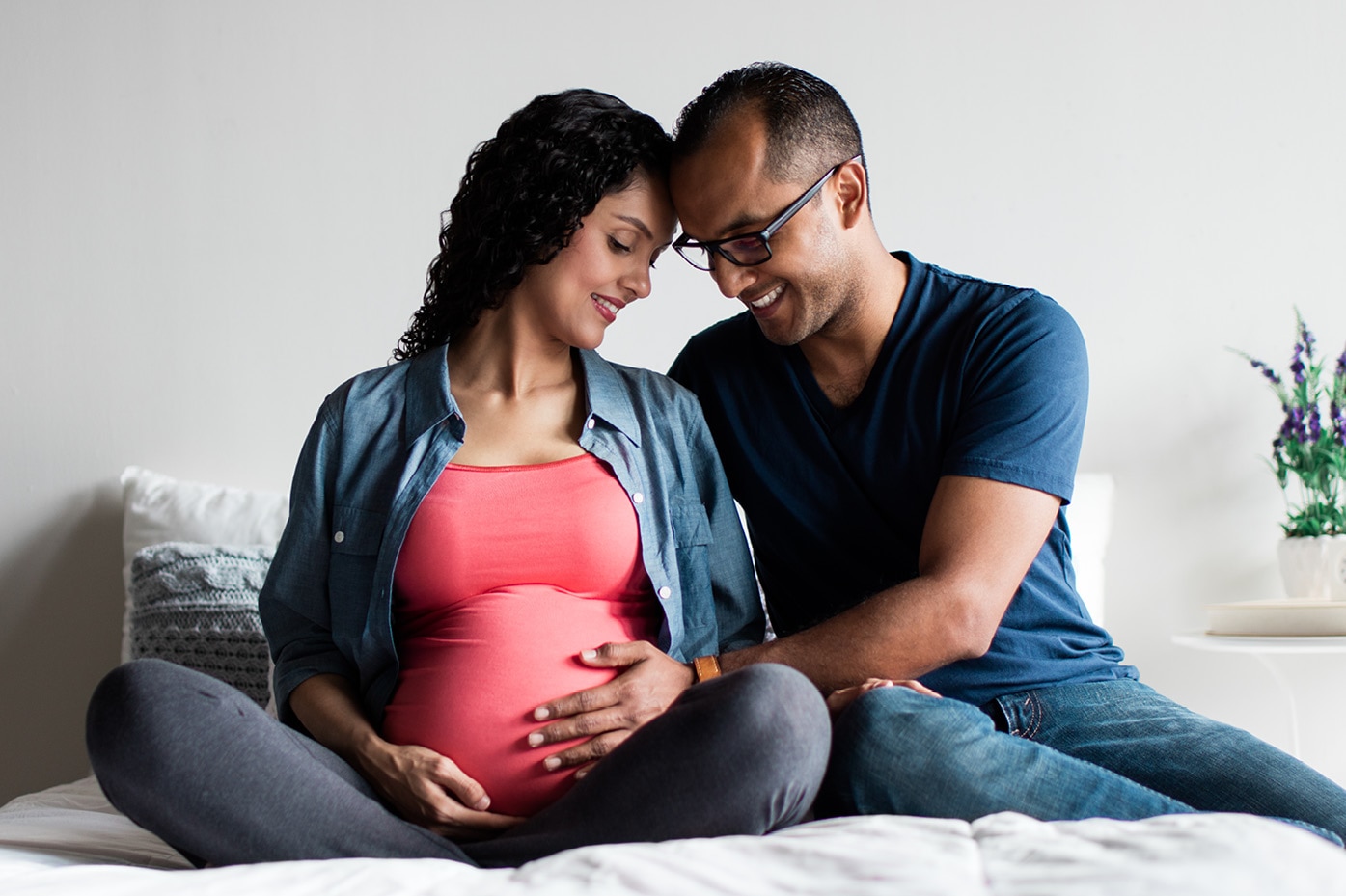 Expectant parents cuddling