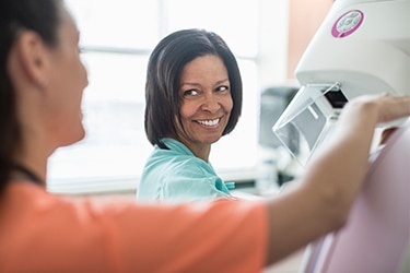 Nurse getting patient ready for an imaging test