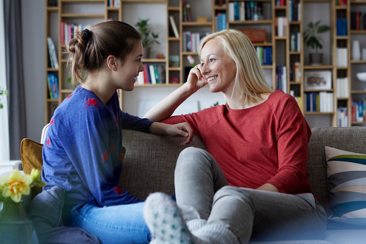 Parent and teen talking on a couch