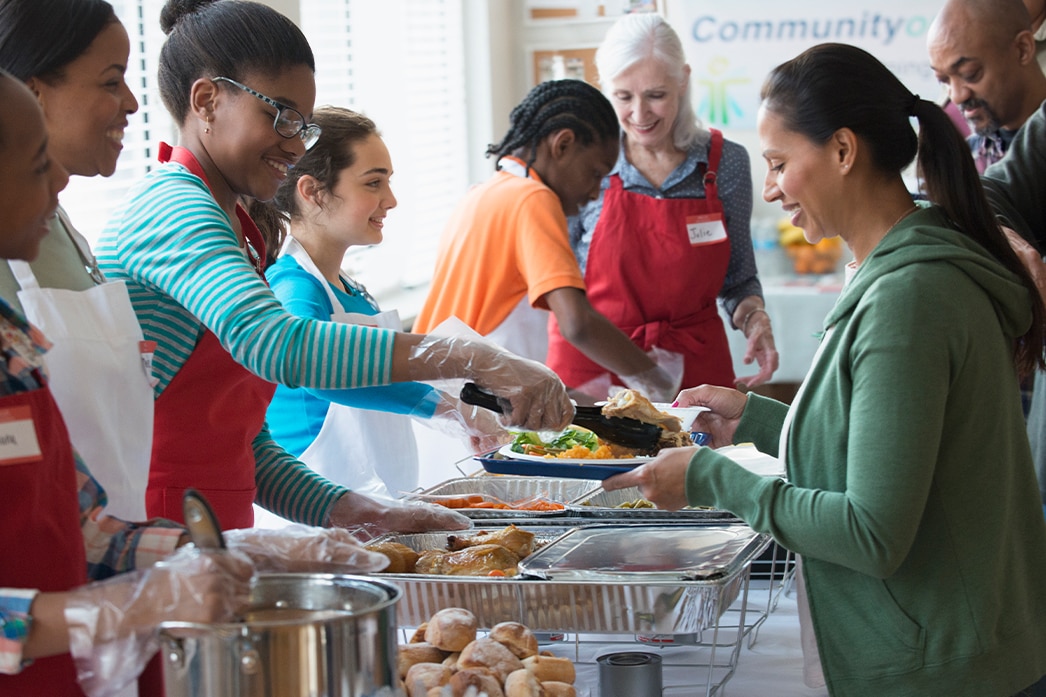 People volunteering and handing out food