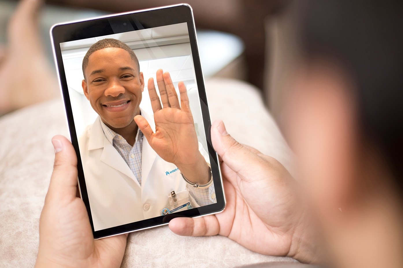 Person video chatting with doctor on phone