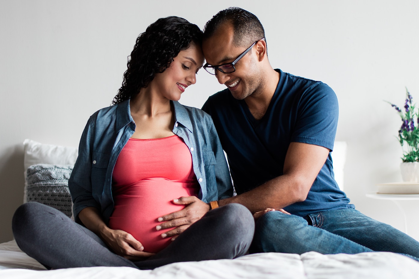 Pregnant couple cuddling