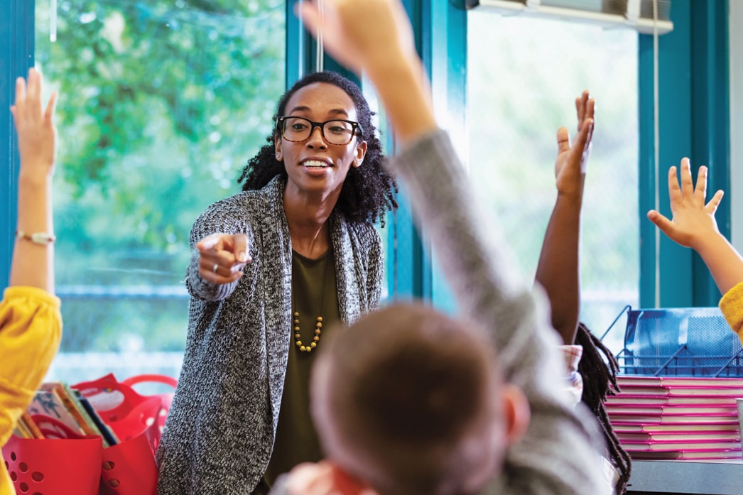 Teacher calling on students in a classroom