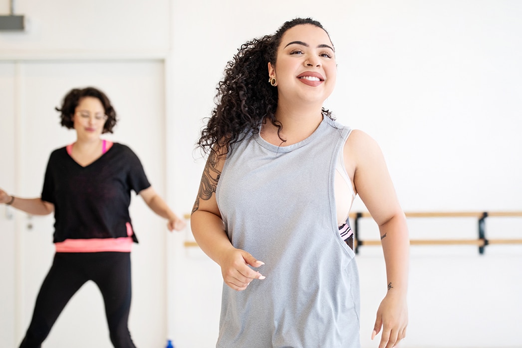 Two people dancing in a dance studio