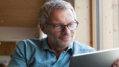 Man looking at tablet